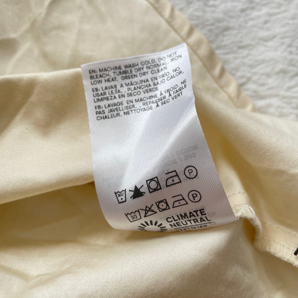 Sleeveless Cream Ruffle-Hem Mini Dress - Picture 11 of 11